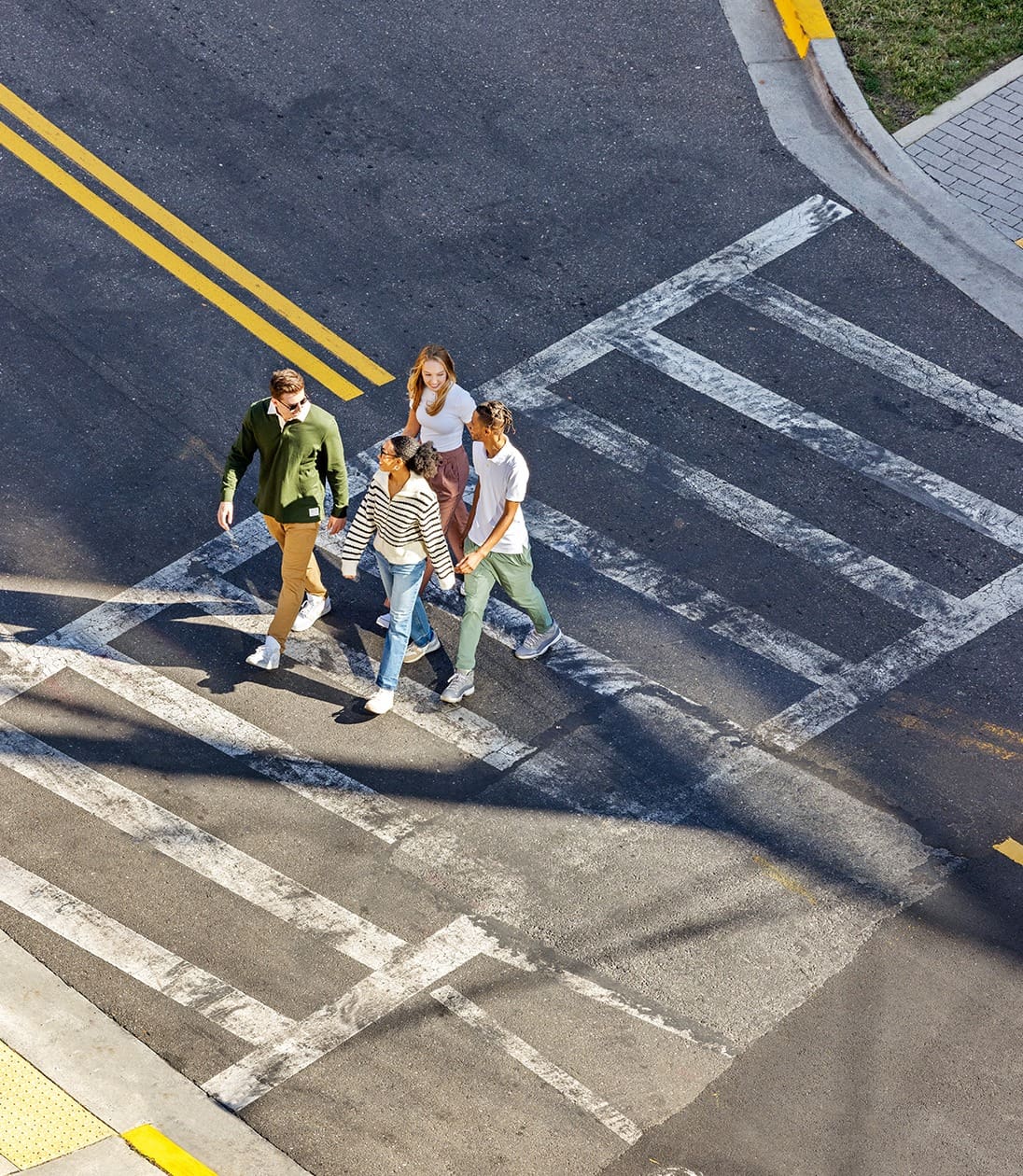 young adults crossing the streets